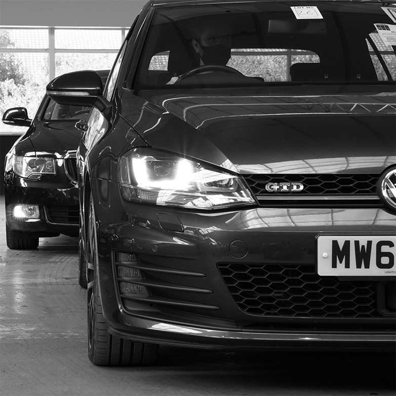 black and white image of a VW in the sale room