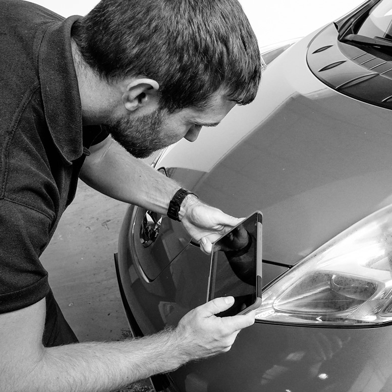 Exterior car inspection by a mechanic