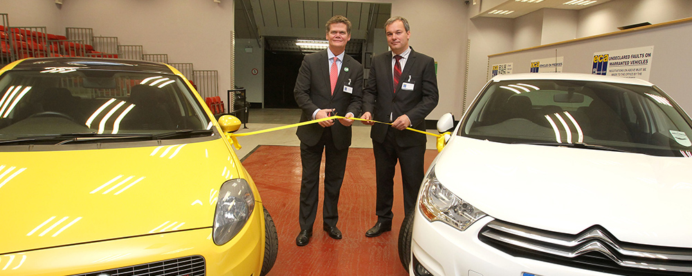 Mp Steven Loyd cutting the yellow ribbon on the new facility